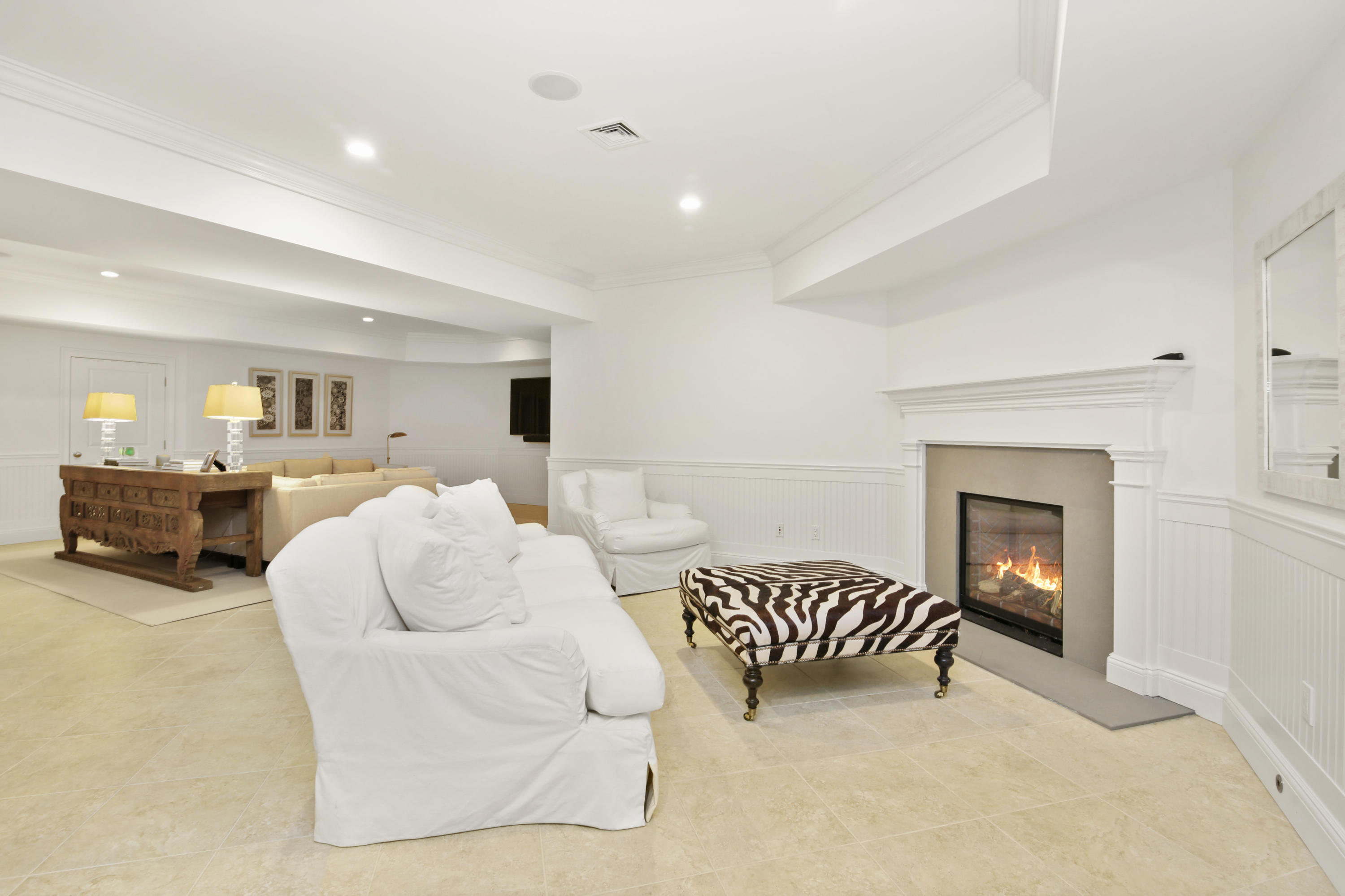 121 Chichester Road New Canaan, CT 06840 - Photo 33 of 42 a living room with furniture and a fireplace