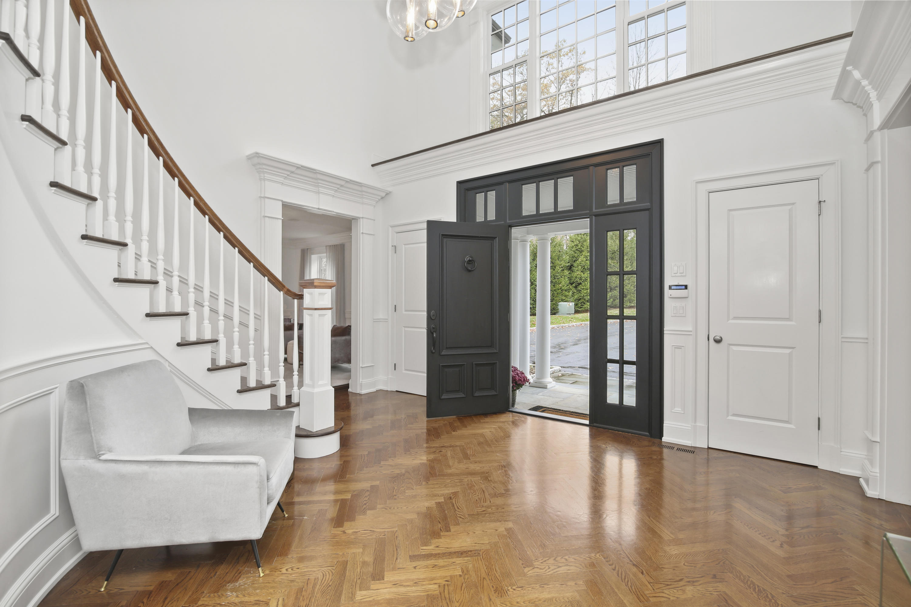 121 Chichester Road New Canaan, CT 06840 - Photo 5 of 42 a view of entryway and hall with wooden floor