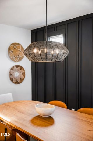 a kitchen with stainless steel appliances kitchen island granite countertop cabinets and wooden floor