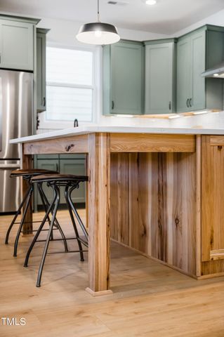 a kitchen with a table and chairs