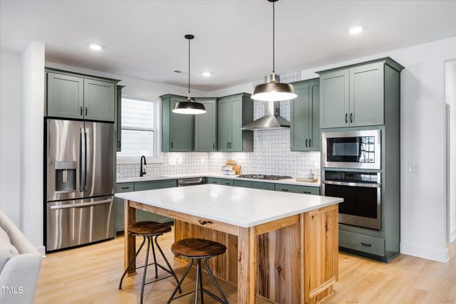a bedroom with a bed couch and a window