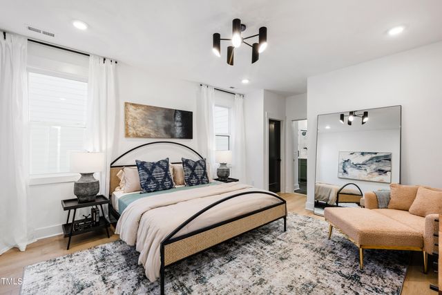 a bathroom with a shower sink and mirror