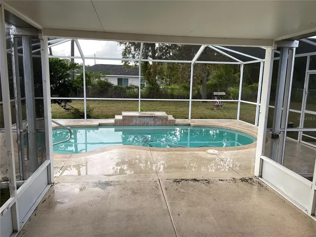 a view of a backyard with a tub and porch
