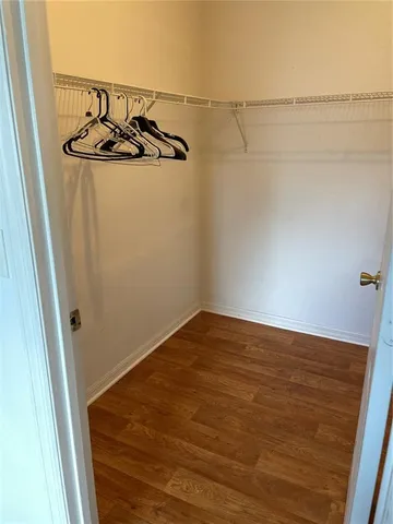 a view of a room with an empty space and a window