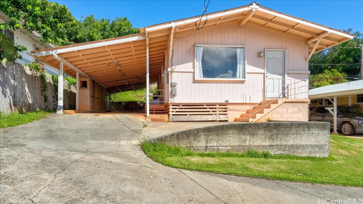 45-557 Keaahala Road, Unit F Kaneohe, HI 96744 - Photo 1 of 1 a view of a house with a yard
