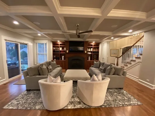 a living room with furniture and a fireplace
