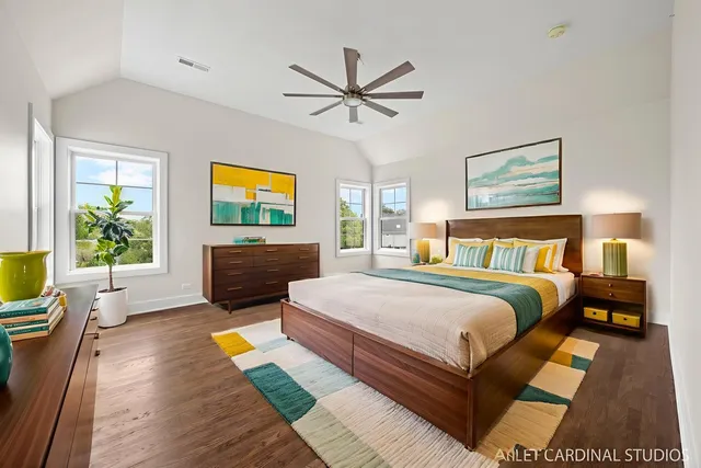 a spacious bedroom with a bed and window