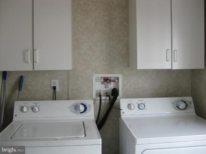 7810 Clark Road, Unit D25 Jessup, MD 20794 - Photo 9 of 19 washer/dryer with storage cabinets