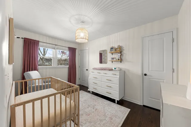 a bedroom with furniture and a window
