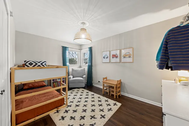 a bedroom with furniture and a window