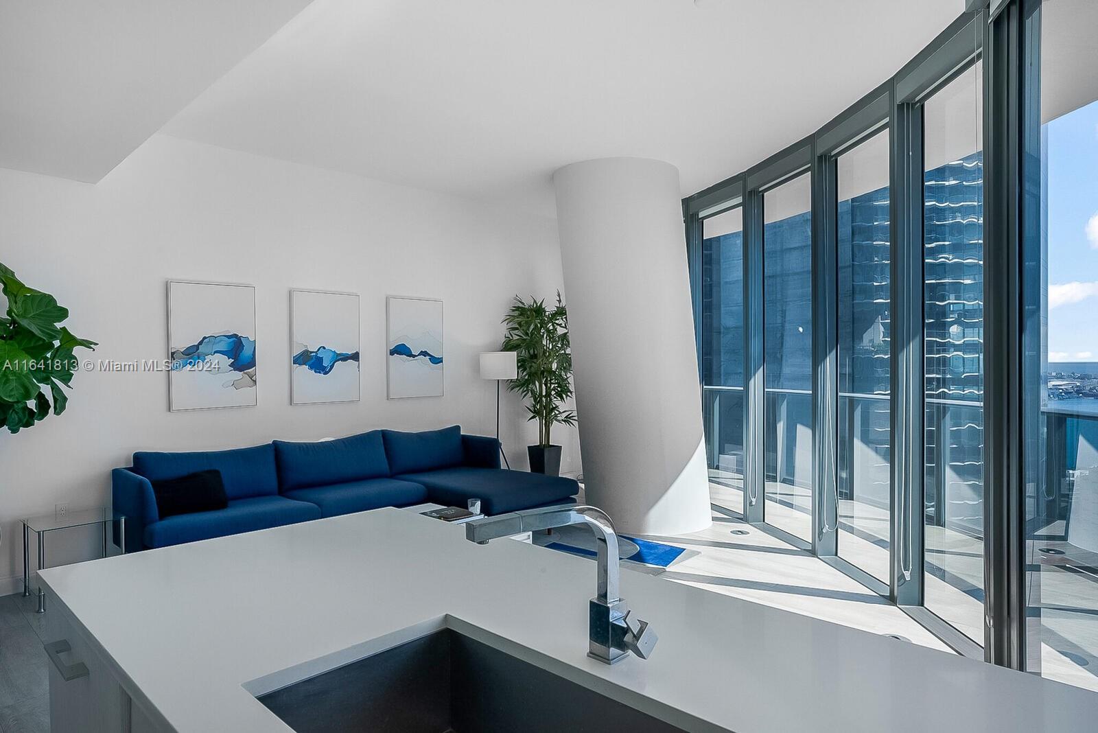 45 Southwest 9th Street, Unit 4403 Miami, FL 33130 - Photo 3 of 21 a living room with furniture