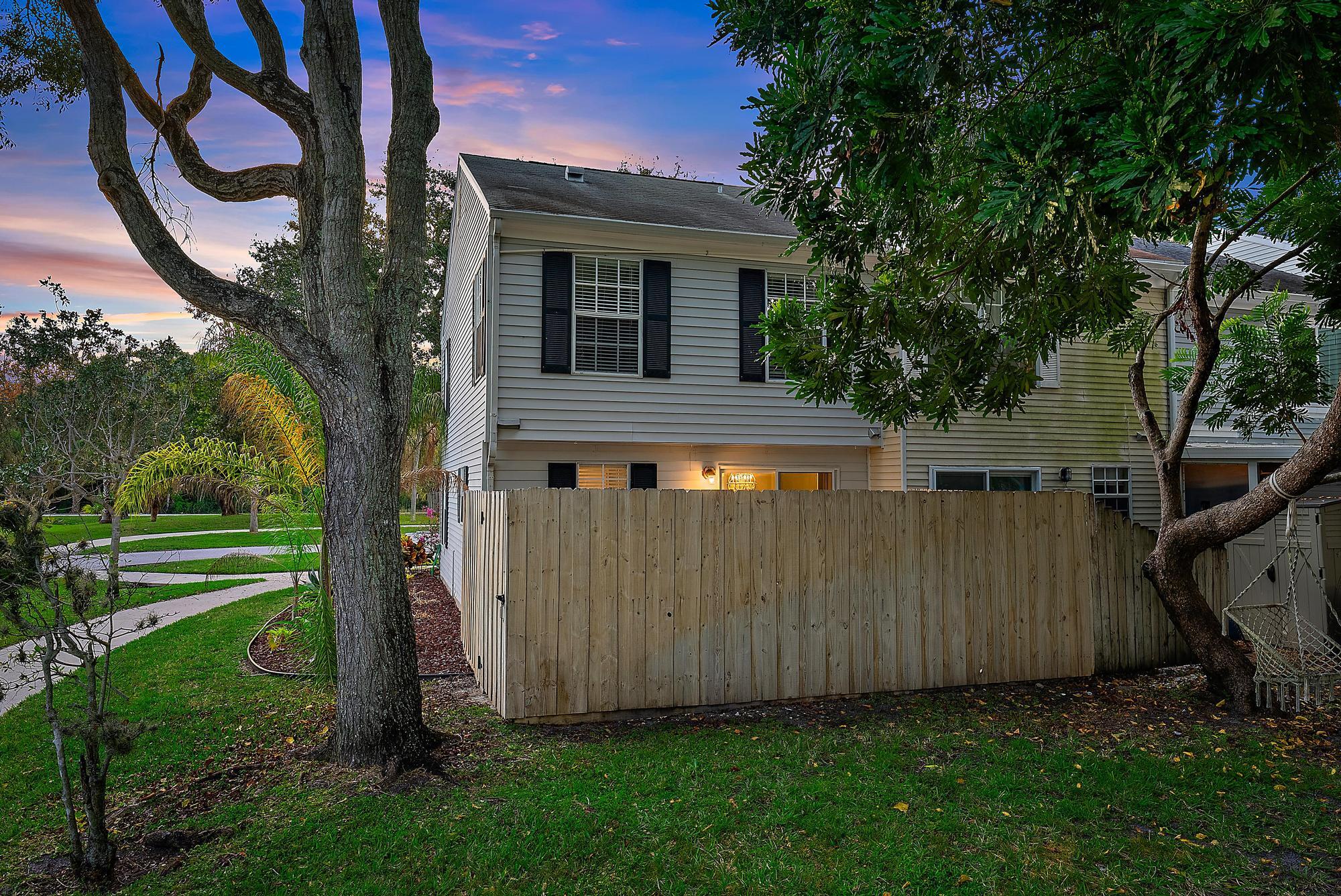 301 Georgian Park Drive Jupiter, FL 33458 - Photo 14 of 33 a front view of a house with garden