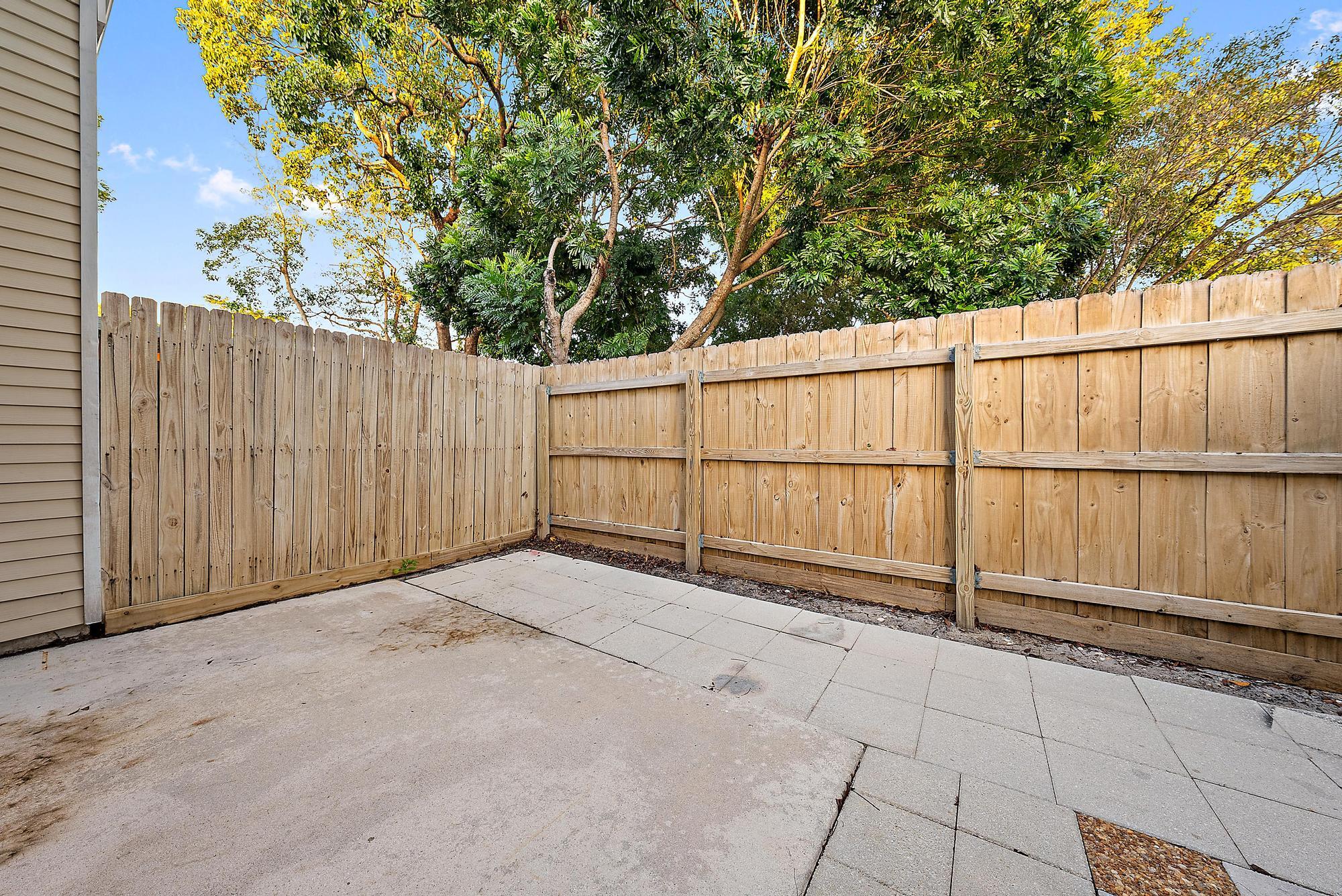 301 Georgian Park Drive Jupiter, FL 33458 - Photo 16 of 33 a view of a backyard