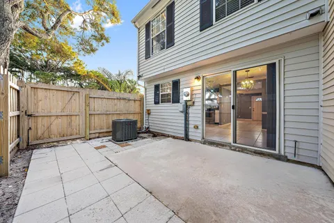 a view of a house with wooden fence