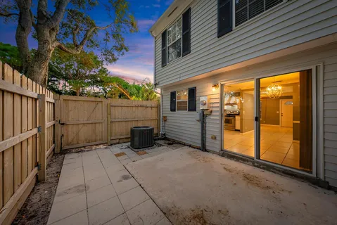 a view of a porch with wooden floor and fence