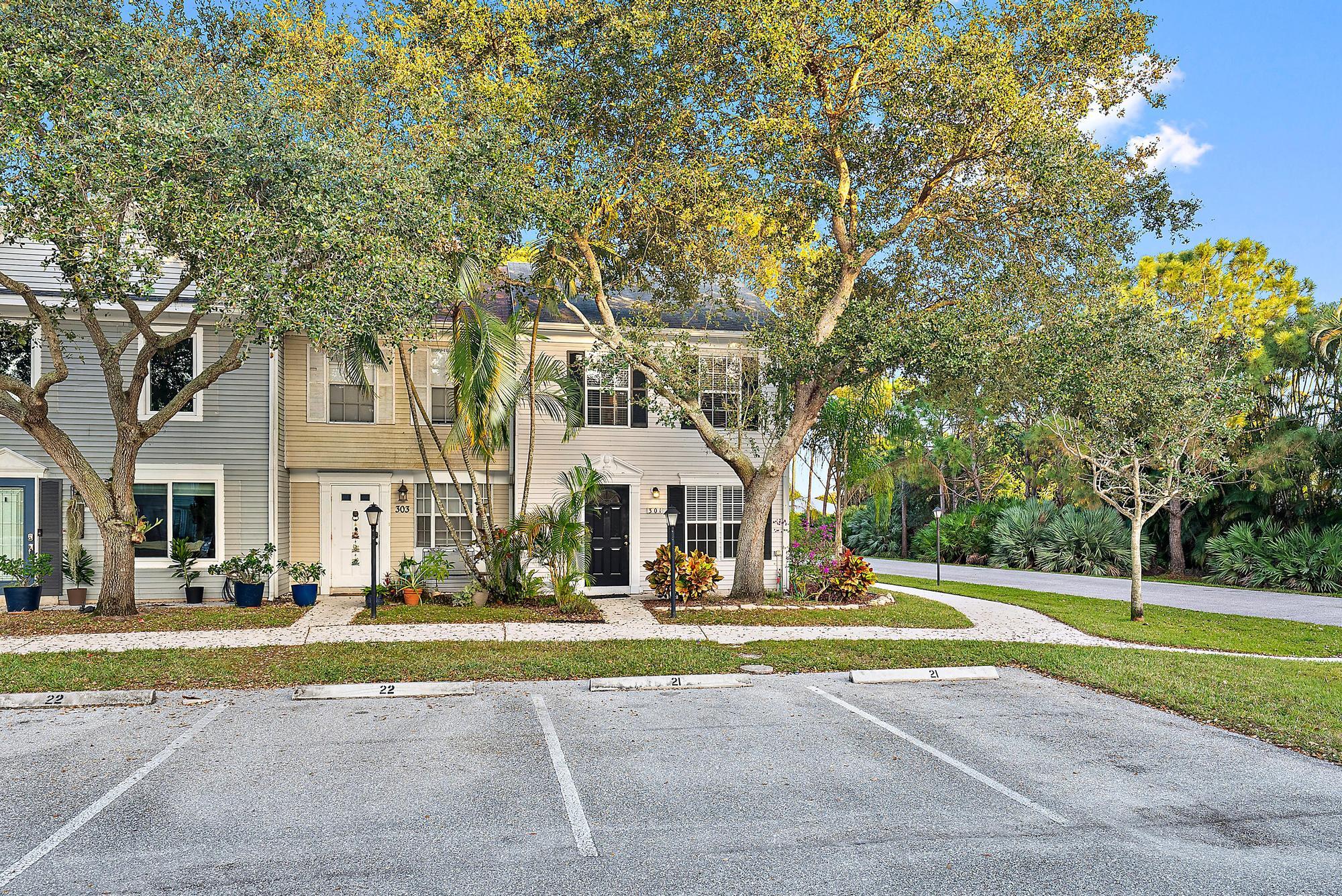 301 Georgian Park Drive Jupiter, FL 33458 - Photo 29 of 33 a view of a big yard with plants and large trees
