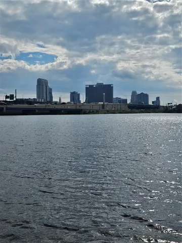 a kitchen with granite countertop a sink and stainless steel appliances