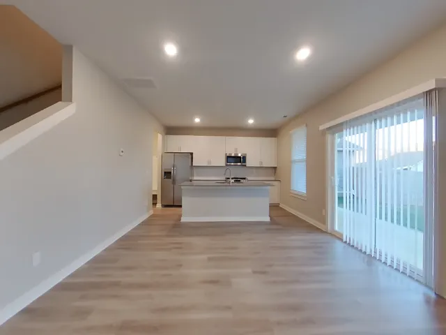 a view of kitchen with wooden floor