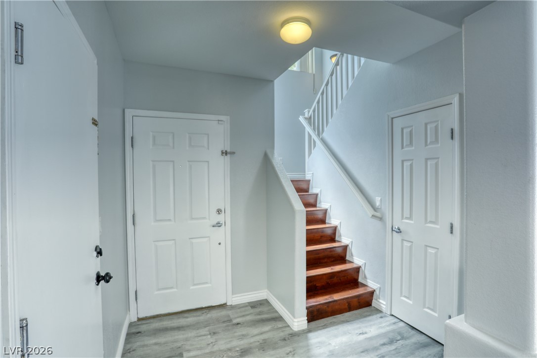 7226 Cestrum Road Las Vegas, NV 89113 - Photo 13 of 28 Foyer featuring stairway and light wood-style flooring
