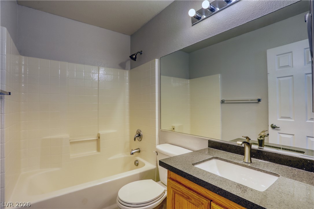 7226 Cestrum Road Las Vegas, NV 89113 - Photo 20 of 28 Full bath featuring vanity and bathtub / shower combination