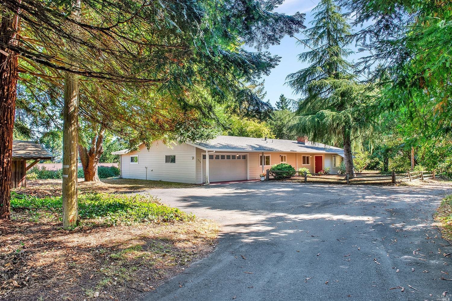 909 Midpine Way Sebastopol, CA 95472 - Photo 1 of 1 a front view of a house with a yard and a garage