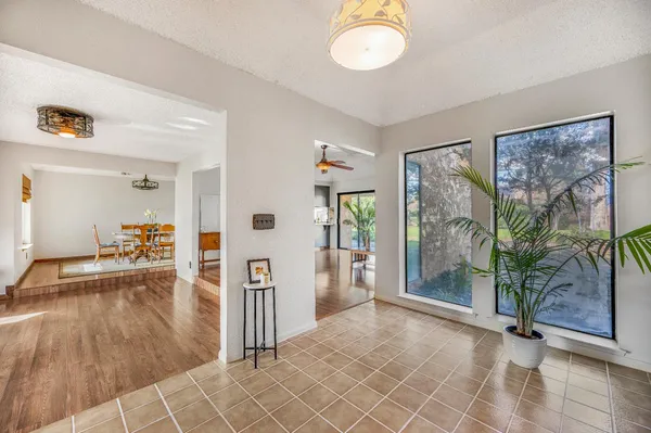 a kitchen with stainless steel appliances a sink a stove top oven a counter space and cabinets