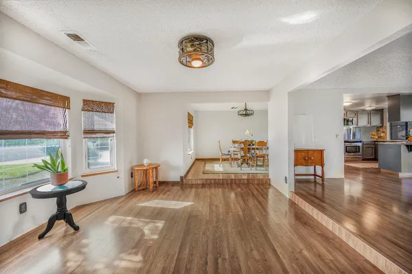 a kitchen with stainless steel appliances granite countertop a sink and a stove