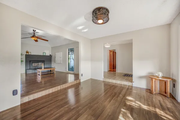 a kitchen with granite countertop wooden cabinets and sink