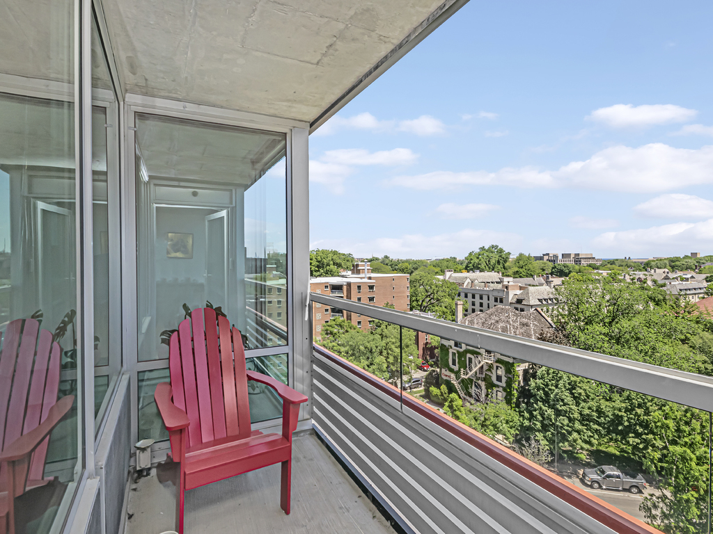 800 Elgin Road, Unit 907 Evanston, IL 60201 - Photo 14 of 17 a view of balcony with two chairs and a table