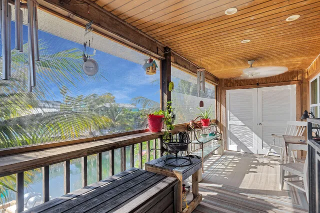 a view of a patio with wooden floor