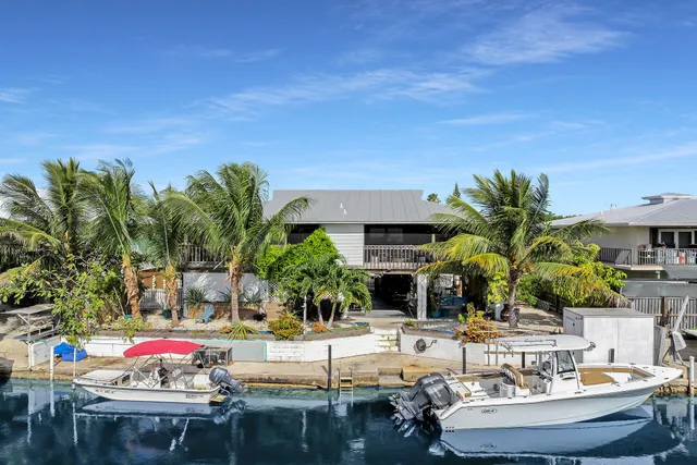 a view of a swimming pool with outdoor seating