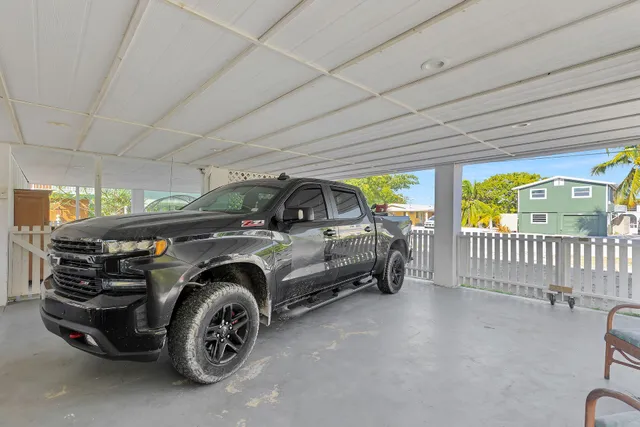 a view of a garage and car parked