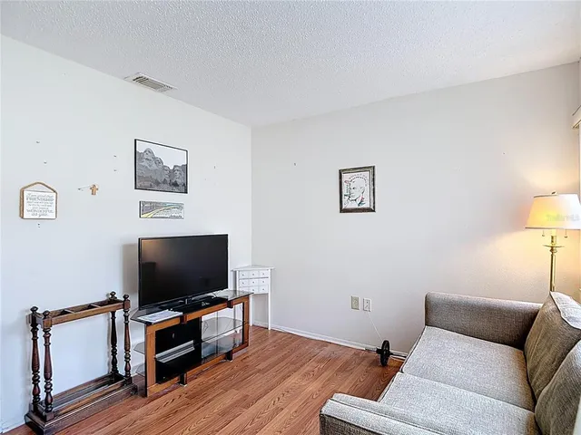 a view of a chairs and table in the balcony