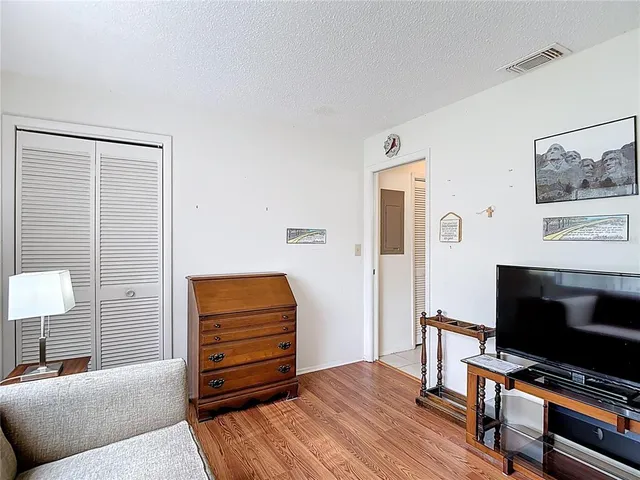 a view of a big house with a yard