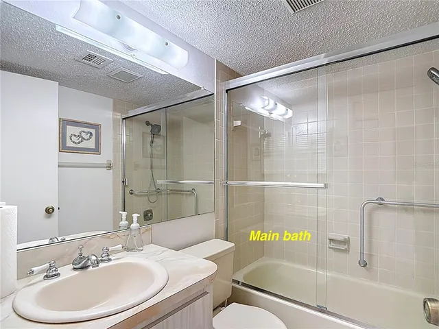 a view of a house with a yard and a garden