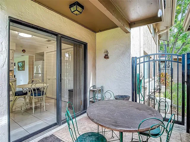 an aerial view of a house with garden space and street view