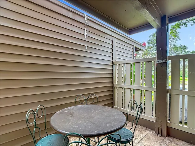 an aerial view of a house with a yard and lake view