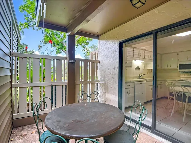 a view of a swimming pool with lounge chairs
