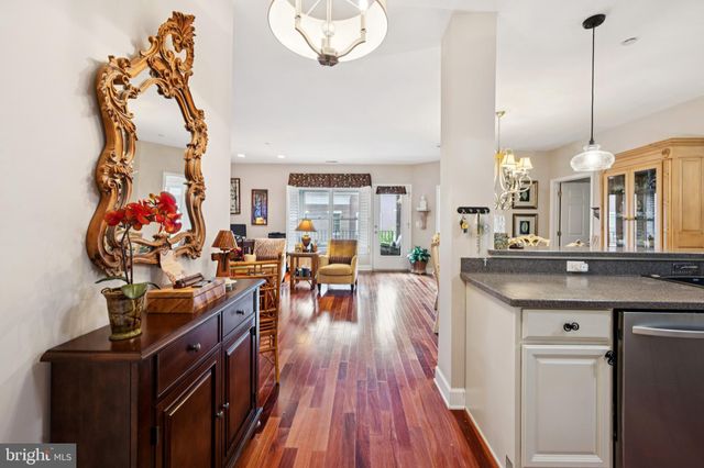 a view of a living room and kitchen