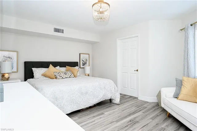 a bedroom with a bed and a couch