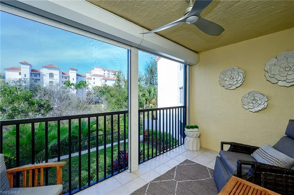 a view of a balcony with furniture