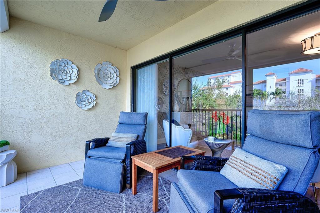 586 Beachwalk Circle, Unit O205 Naples, FL 34108 - Photo 22 of 36 a view of a dining room with furniture window and outside view