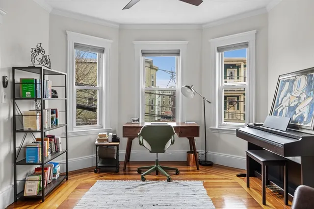 a work room with furniture and a window