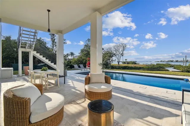 a view of a chairs and table in patio
