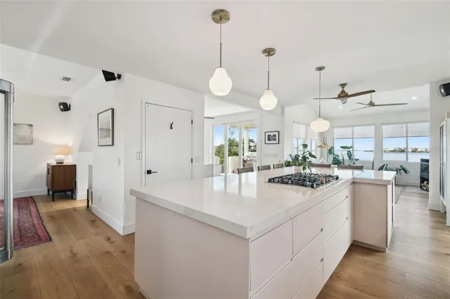 a large white kitchen with lots of counter space