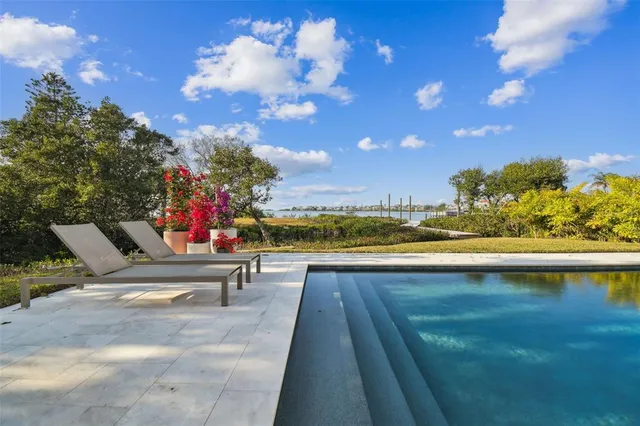 a view of a balcony with dining table