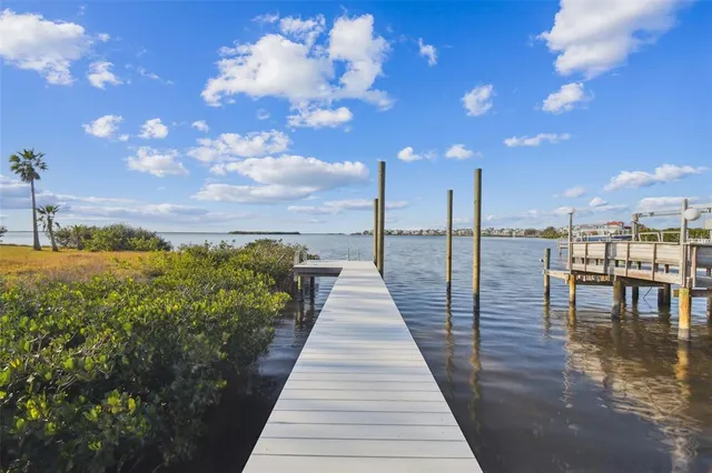 a view of a balcony with a table under an umbrella