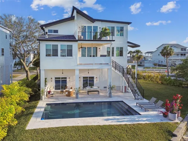 a view of a swimming pool with an outdoor seating