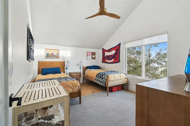 a bedroom with furniture and a window