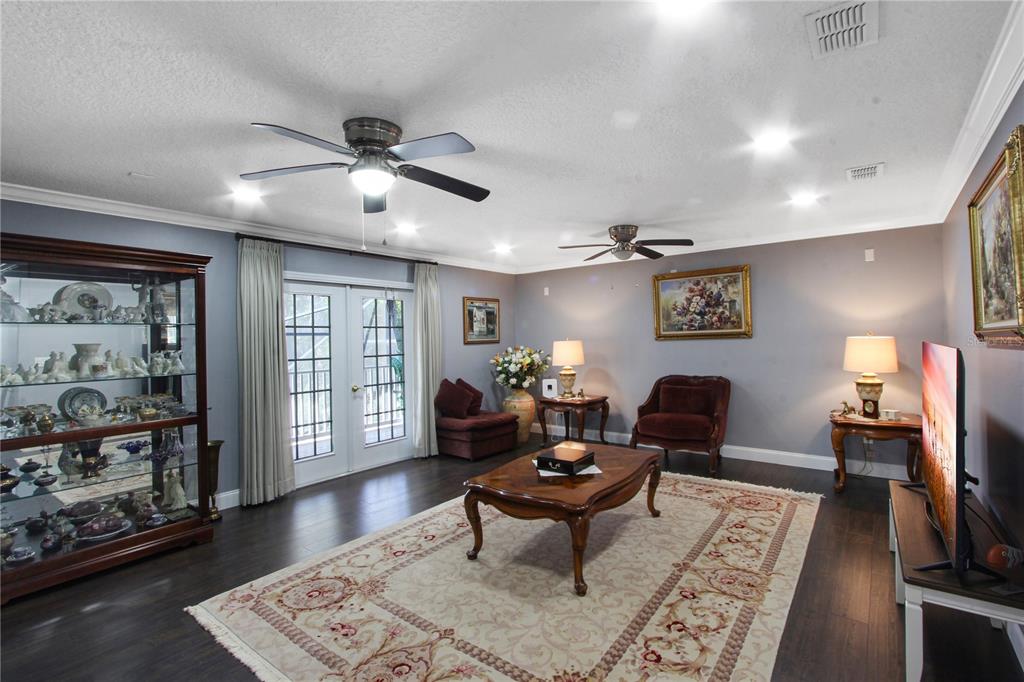 5536 Ansley Way Mount Dora, FL 32757 - Photo 19 of 49 a living room with furniture and wooden floor